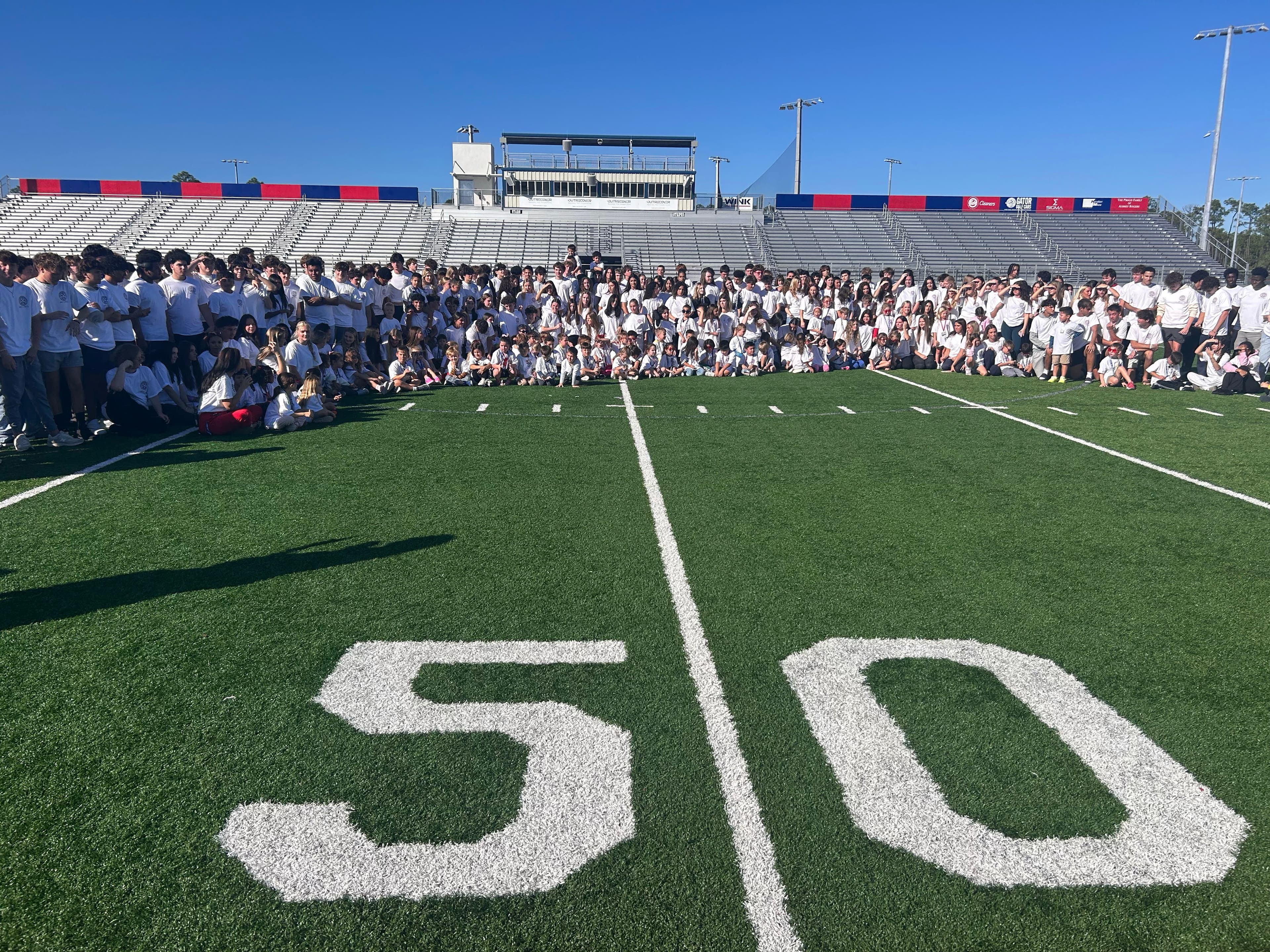 Kindergartners meet high school seniors in heartwarming "Pats to PATS" event