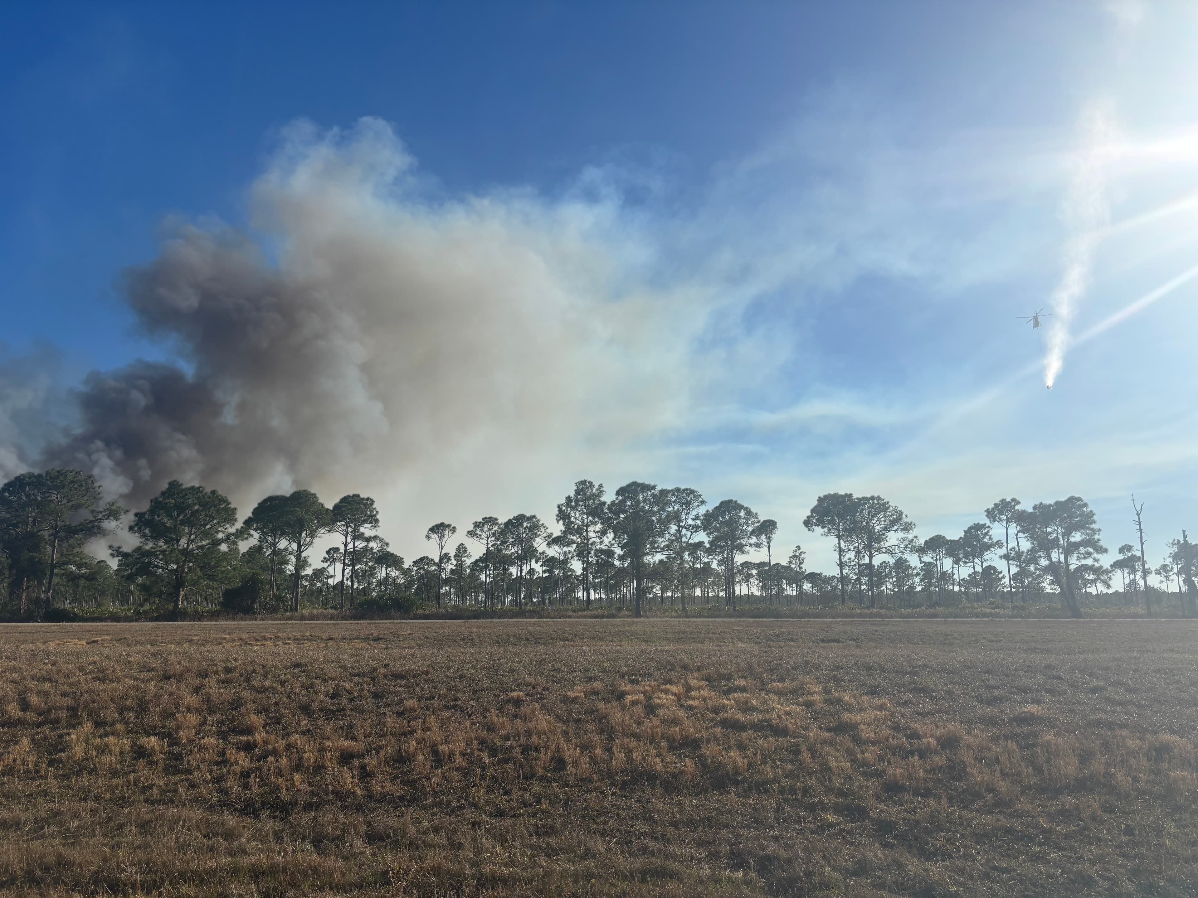 Firefighters battling 50-acre brush fire southeast of LaBelle