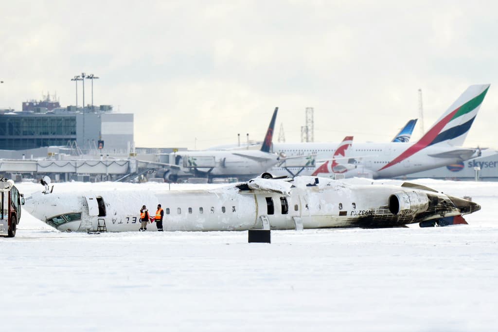 Passengers offered $30,000 after plane flips on Toronto runway