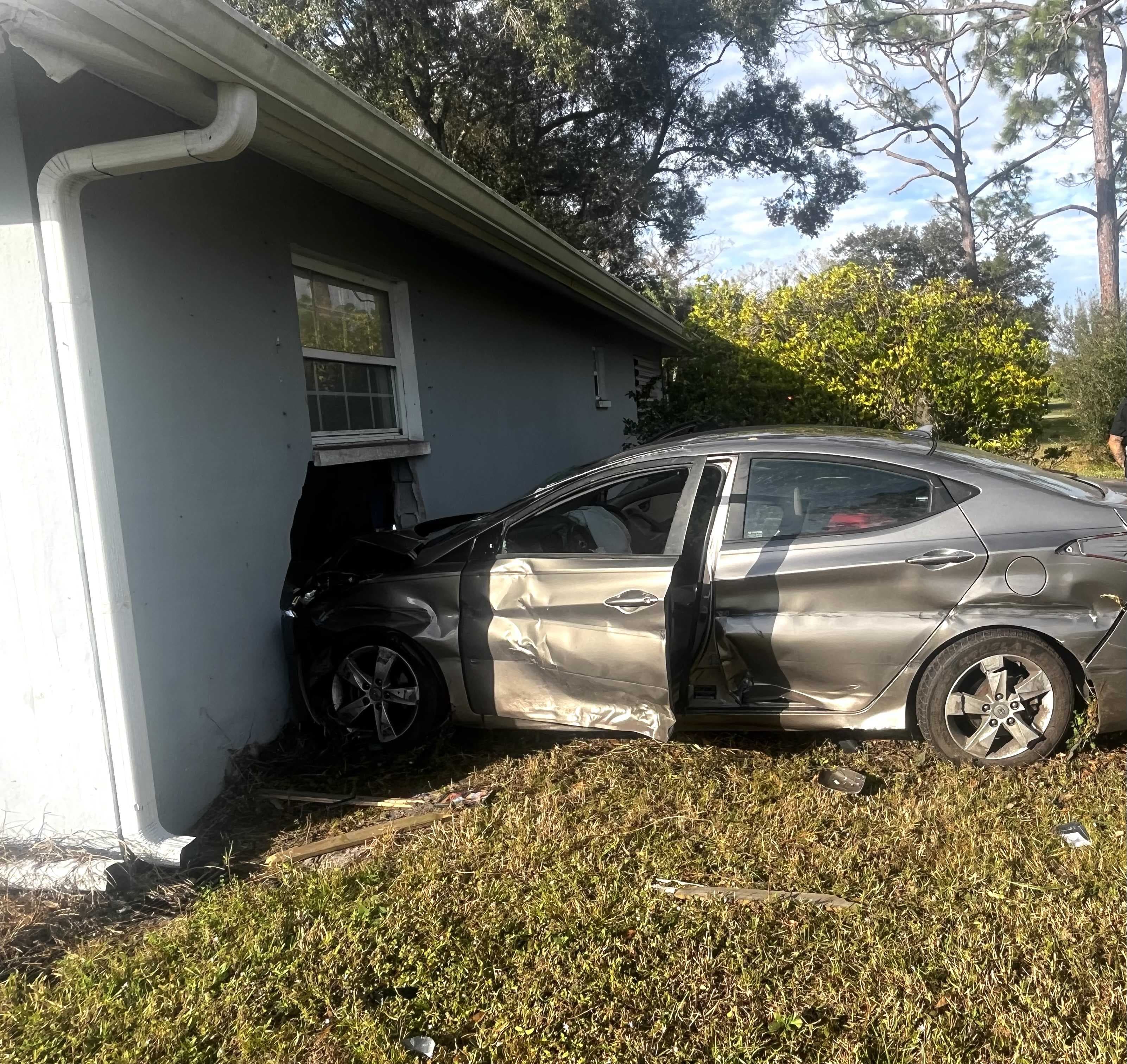 Car veers off I-75 and crashes into North Fort Myers home; two arrested