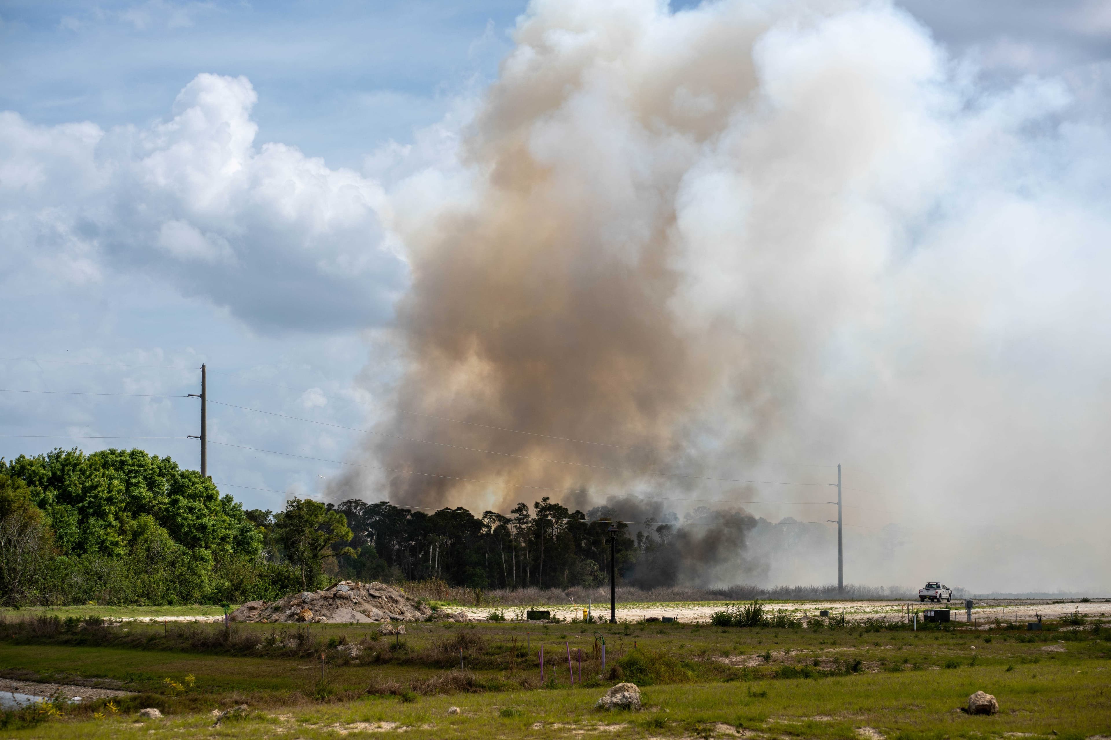Crews battle brush fire near Gish Lane in North Fort Myers
