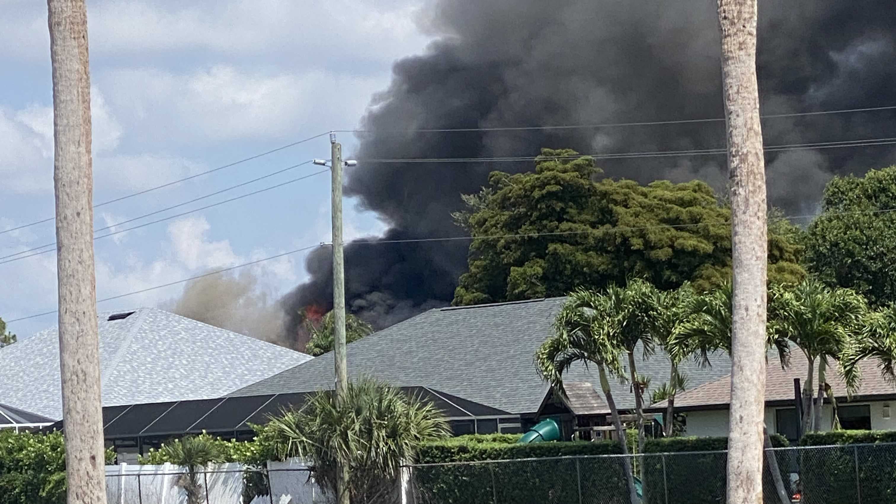 Firefighters battle large fire on Caloosa Trace Circle near San Carlos Park Elementary School