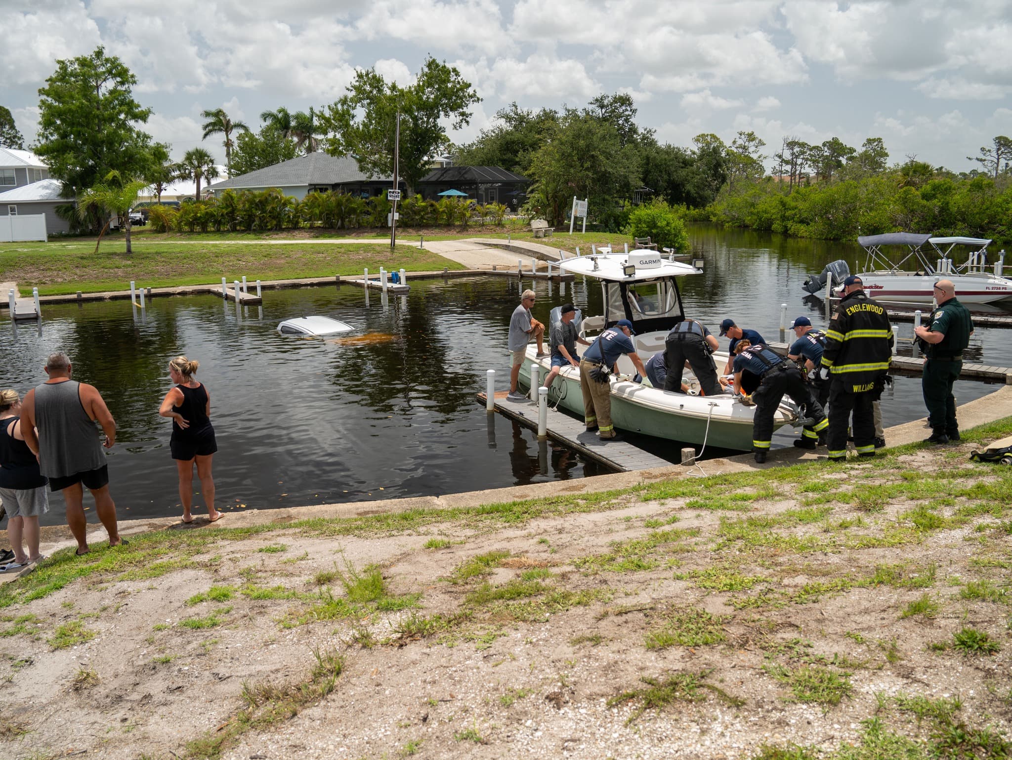 Neighbors rescue man after truck plunges into Oyster Creek