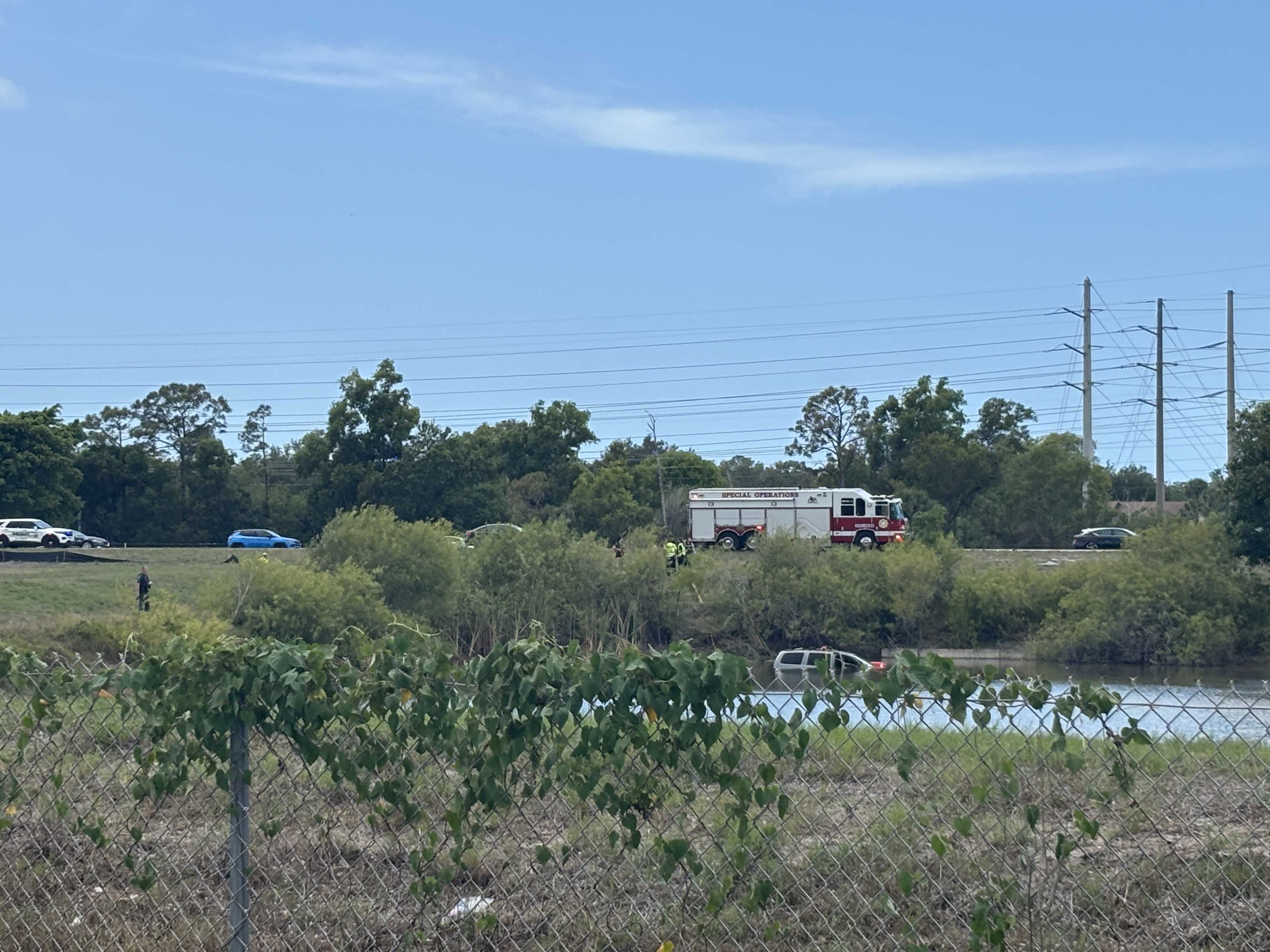 Car crashes into lake off I-75 in Bonita Springs; Divers search for possible occupants