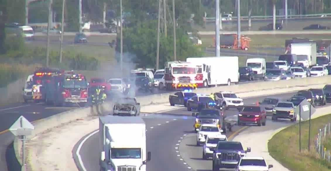 Smoke pours from car along I-75 near Alico Road exit