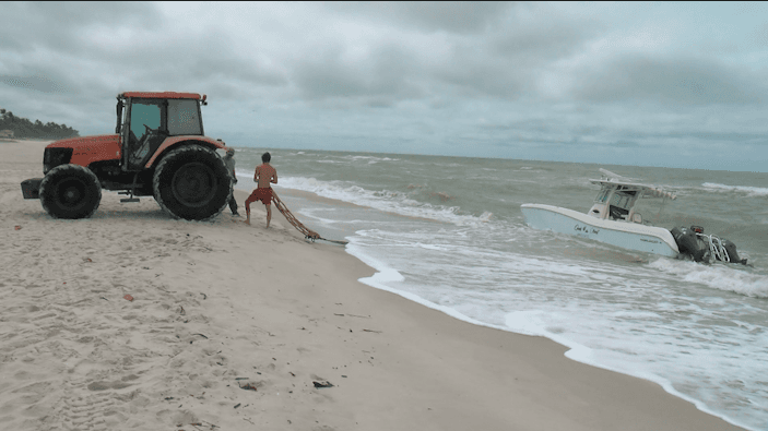 Boat left beached and broken after water rescue in Naples