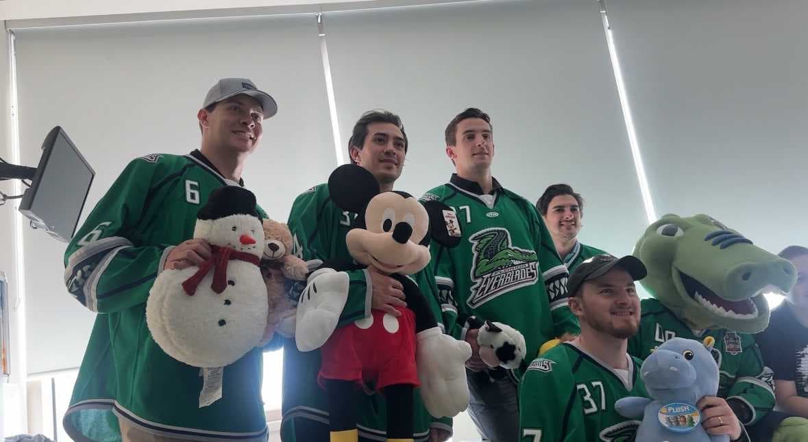 Everblades hand out toys from Teddy Bear Toss at Golisano's Children's Hospital and Lee Health Coconut Point